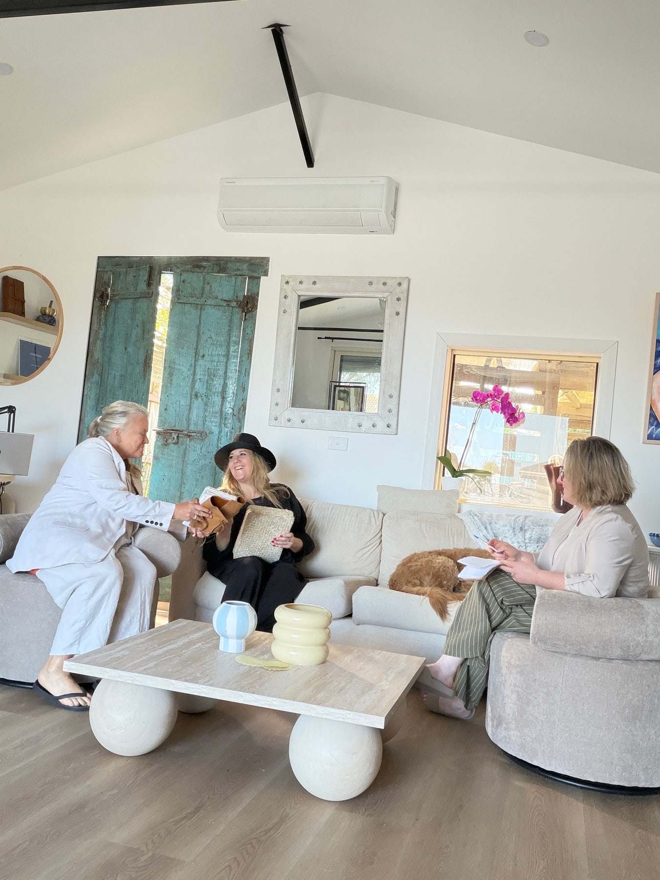Women in conversation in the bright lounge of The Confidence Studio in Ocean Grove